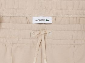Женские хлопковые спортивные брюки-клёш Lacoste