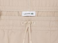 Женские хлопковые спортивные брюки-клёш Lacoste