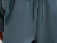 Трикотажные брюки объемного кроя из футера