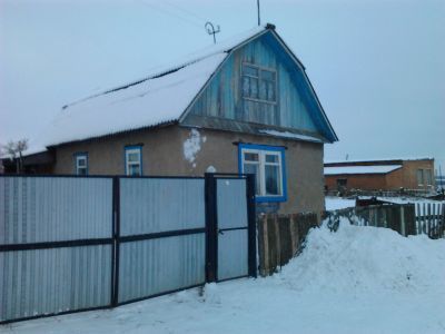 Деревянный жилой дом начала XX века с богатым резным декором