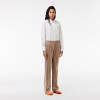 Женские расклешенные спортивные брюки Lacoste с монограммой