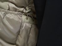 Утепленное полупальто с накладными карманами