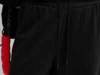 Трикотажные брюки объемного кроя из футера