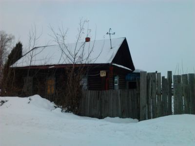 Деревянный жилой дом начала XX века с резным декором