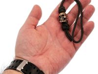 Темляк средний олива с бусиной "Большой череп"