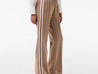 Женские расклешенные спортивные брюки Lacoste с монограммой