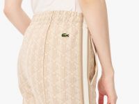 Женские расклешенные спортивные брюки Lacoste с монограммой