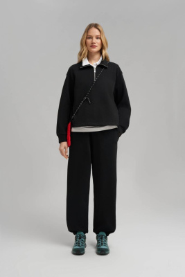 Брюки-джоггеры объемного кроя из футера