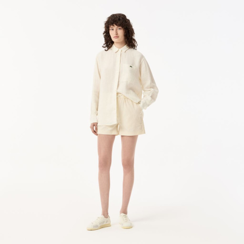 Женские короткие однотонные шорты Lacoste